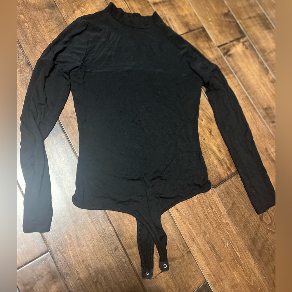 WINDSOR Black bodysuit with sheer sleeves and neckline.